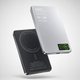 Two wireless charging devices, one black and one silver, on a light gray background.